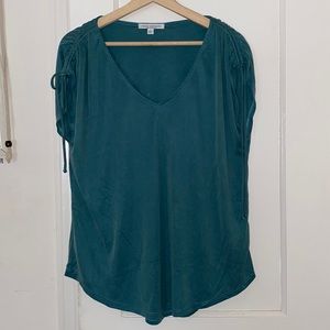 Blue T-shirt with ties on the arms. V neck. Worn once. Cute for summer.